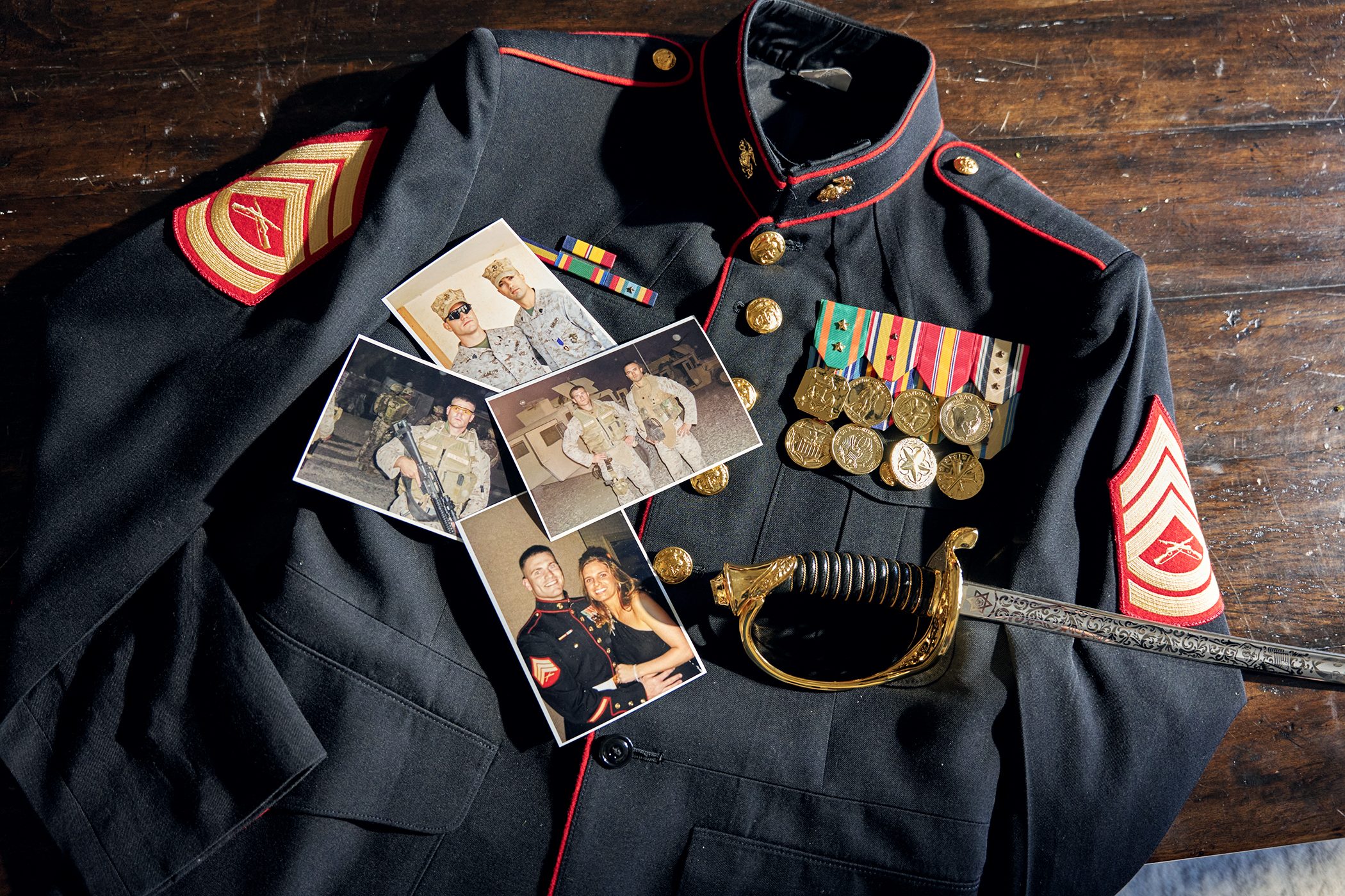 Marine Corps dress blue uniform with medals and old service photos
